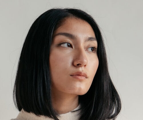 Model In Neutral Colors By Window